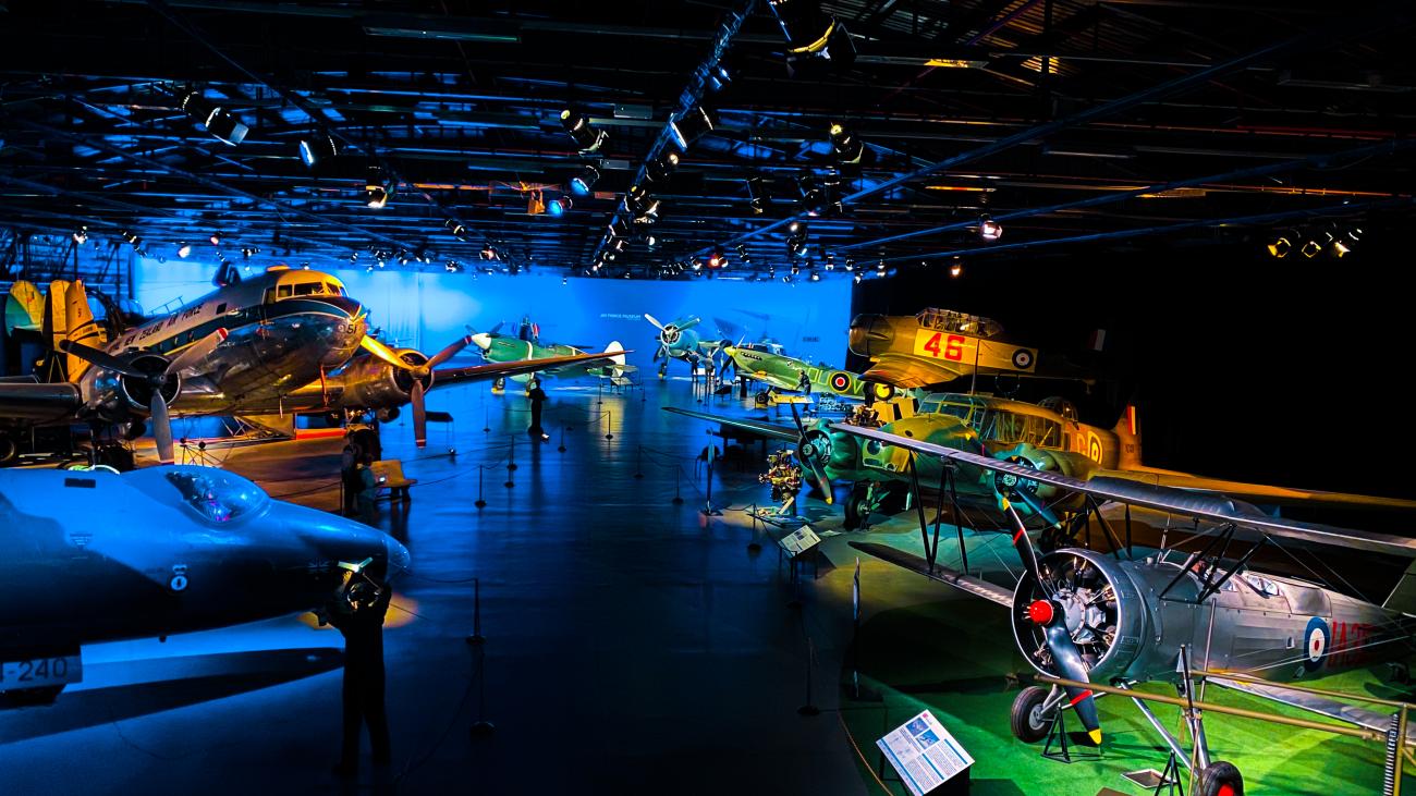 Interior of the Air Force Museum in Christchurch featuring vintage military aircraft on display.