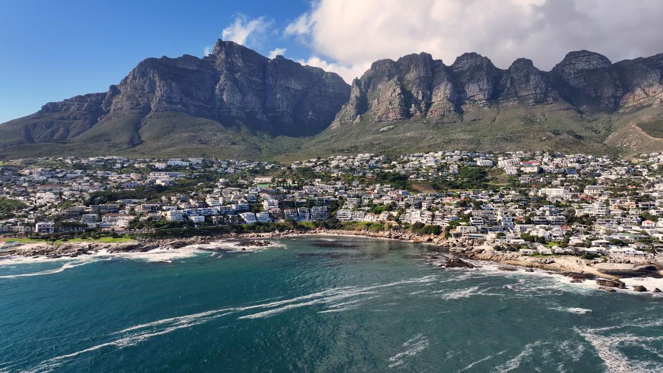 Camps Bay beach with Twelve Apostles mountains Cape Town